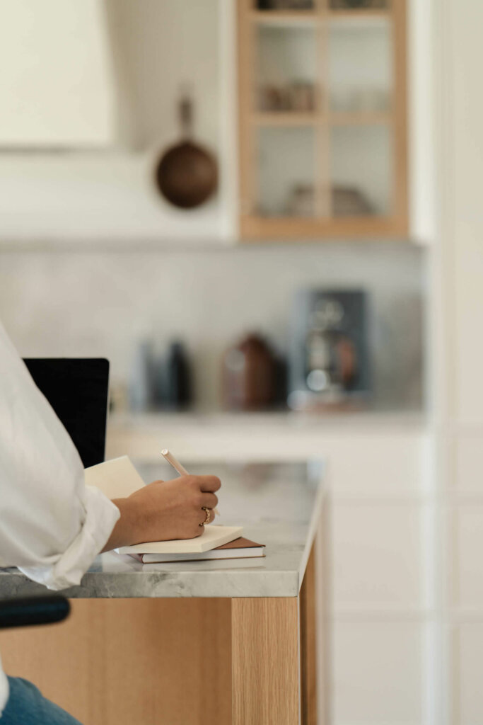 Service Provider Verifying Domain In Flodesk On Computer In Kitchen