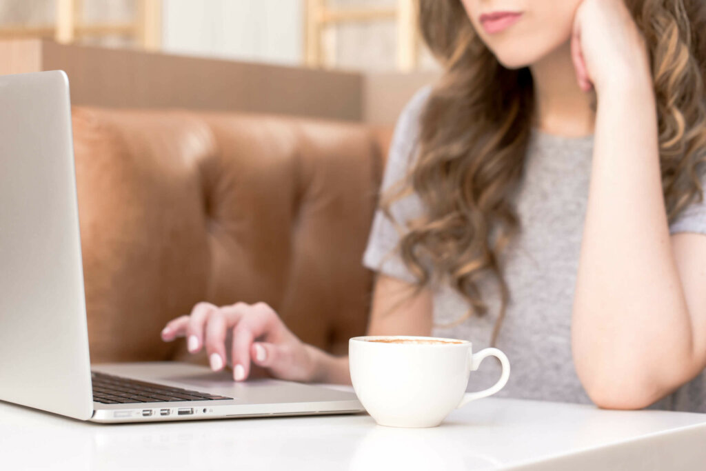 Women Working On Business At Coffee Shop Using Dubsado