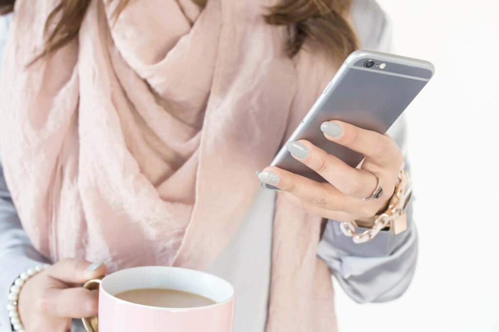 Business Owner Searching Online With Phone