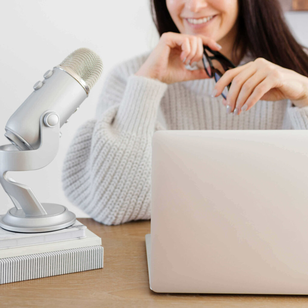 Female Entrepreneur Web Designer Setting Up Google My Business Profile Wearing A Tan Sweater