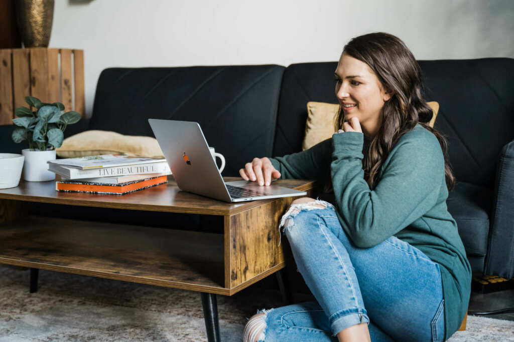 Owner Of Southern Creative Looking At Convertkit Vs. Flodesk On Computer