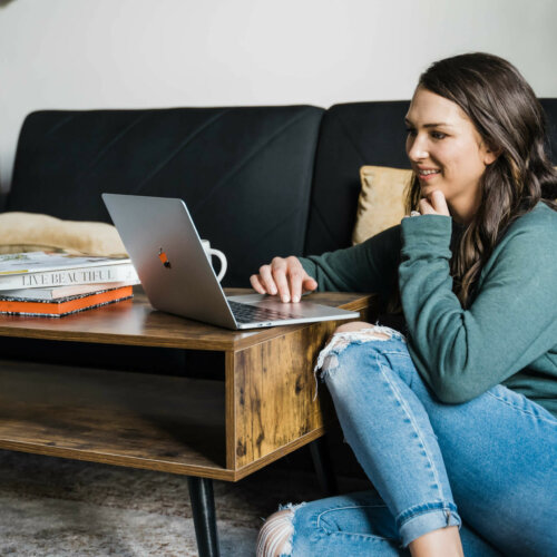 owner of southern creative looking at convertkit vs. flodesk on computer