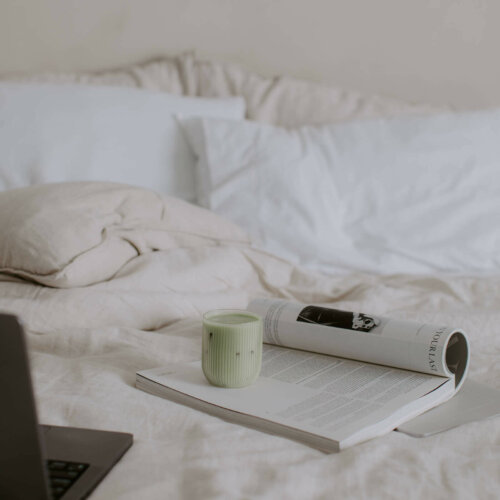 laptop on bed in home office