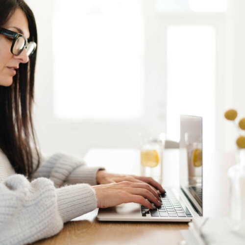 interior designer connecting convertkit to wordpress website at home office.