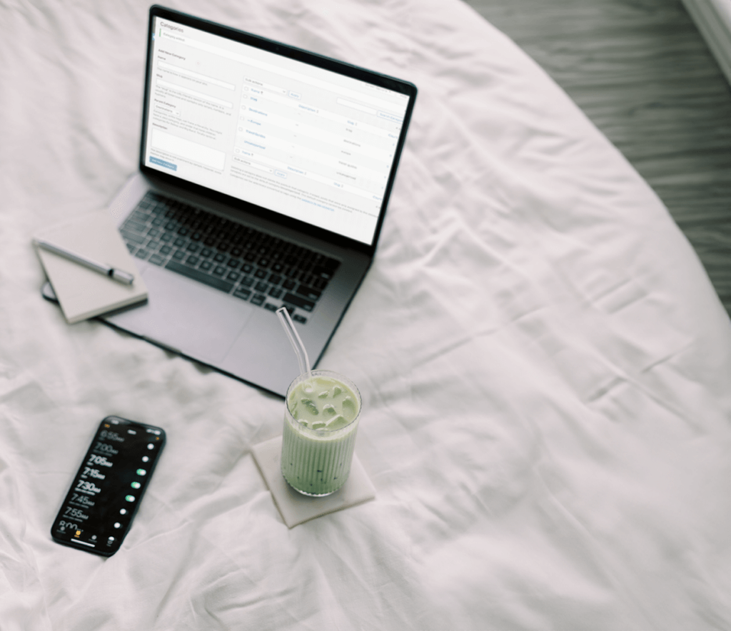 Wordpress Categories Vs. Tags On Laptop On Bed With Matcha Drink.