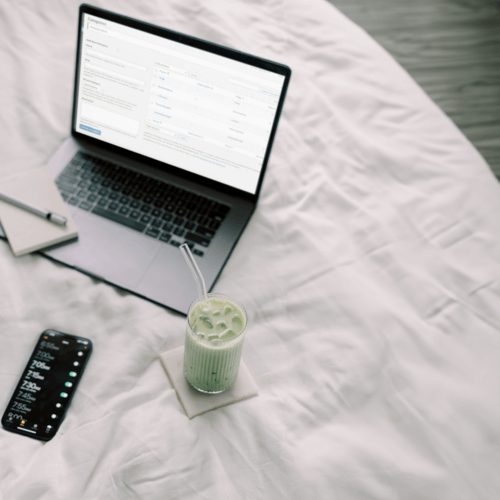 WordPress Categories vs. Tags on laptop on bed with matcha drink.