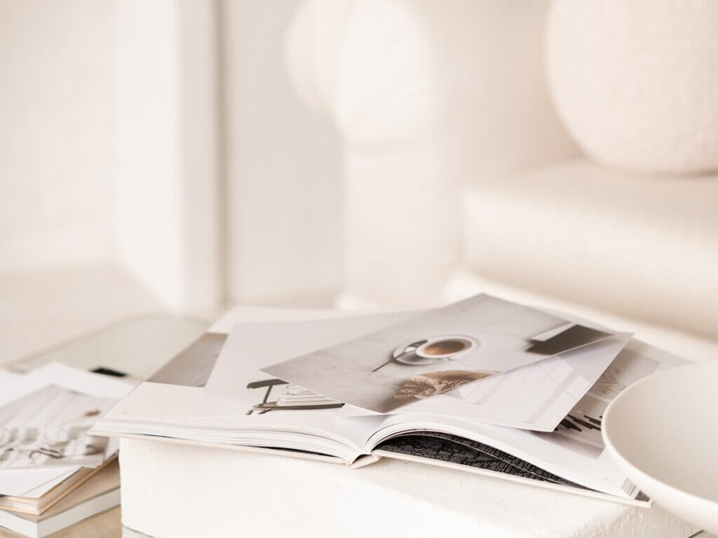 Interior Designer At Home Studio With Pile Of Papers Working On Seo For Interior Designers