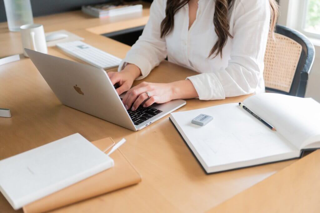 What Is An Seo Title? Seo Strategist, Stephanie Okeefe, Typing On Computer In Home Office In Raleigh, Nc.