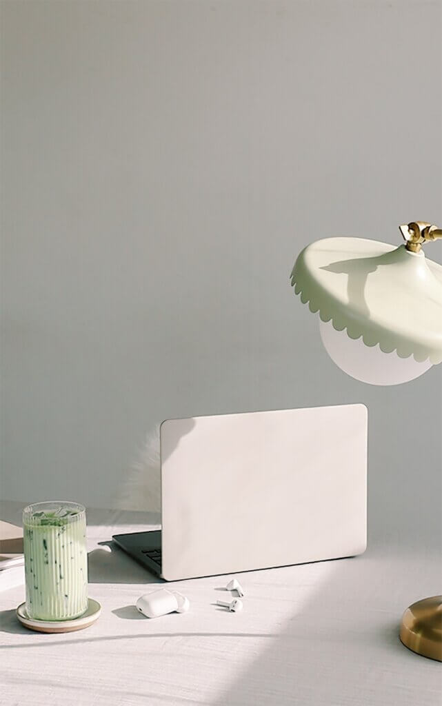 Laptop, Airpods, And Green Latte On Desk.