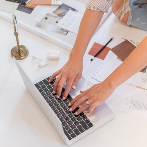 Southern Creative owner, Stephanie O'Keefe typing on Computer adding a contact form in WordPress