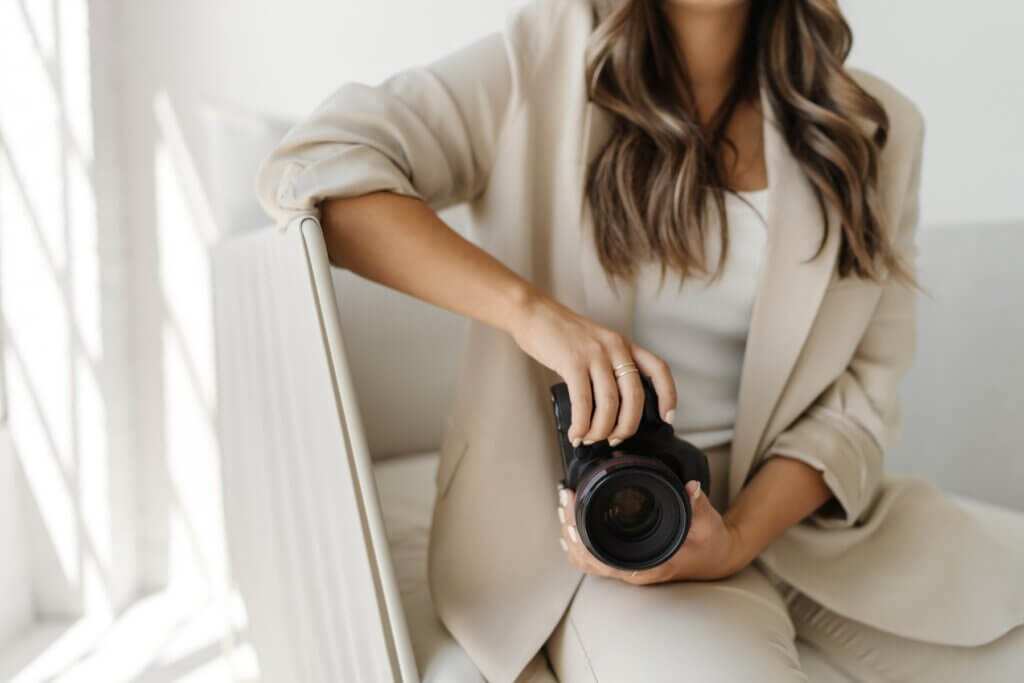 Photographer Holding A Camera During Brand Shoot