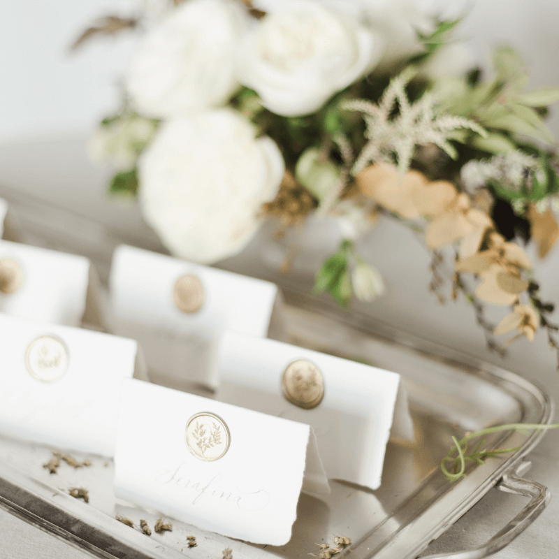 Event Planner Display Of Namecards And Flowers