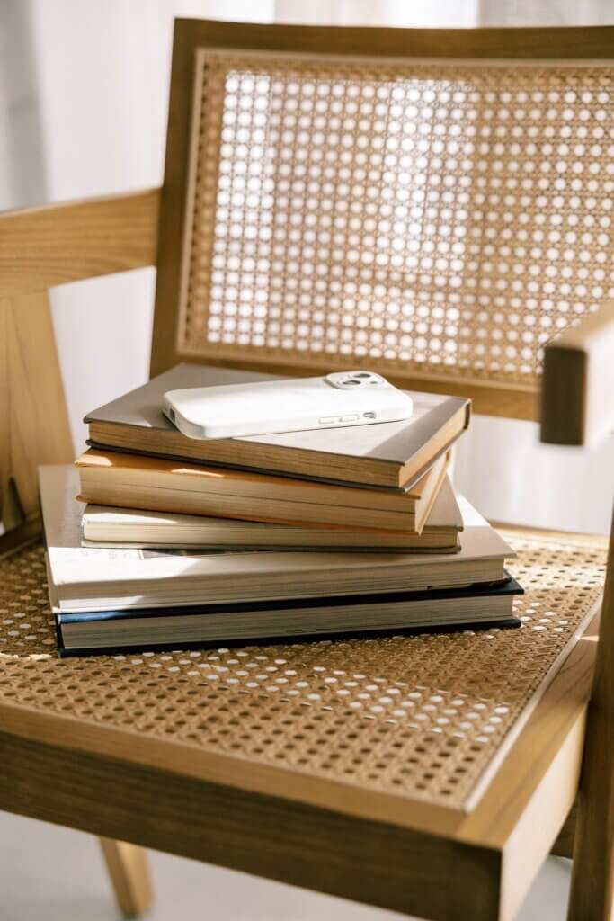 Stack Of Interior Design Books On Cane Chair