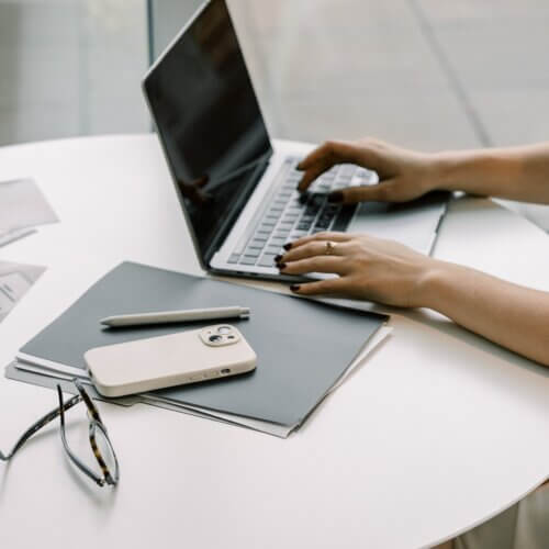 business owner typing on laptop
