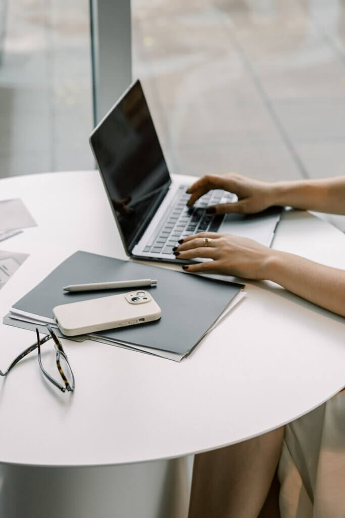 Business Owner Typing On Laptop