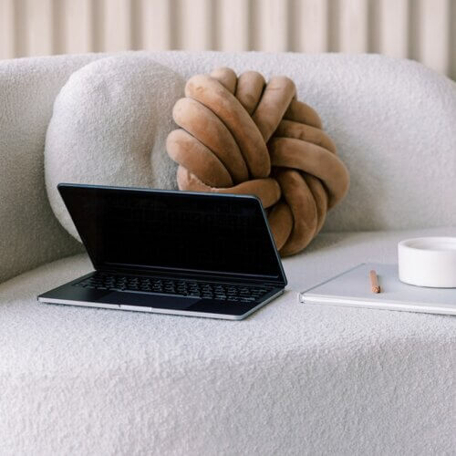 Laptop On White Couch