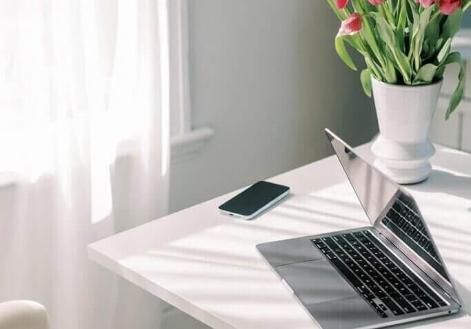 laptop on desk at home office.