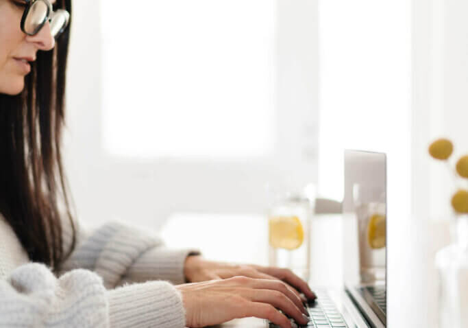 interior designer connecting convertkit to wordpress website at home office.