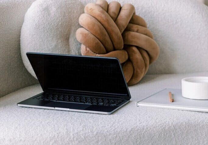 laptop on white couch