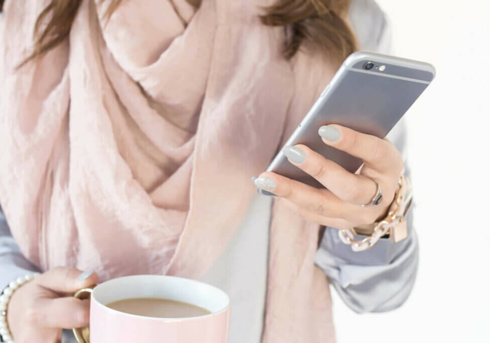 business owner searching online with phone