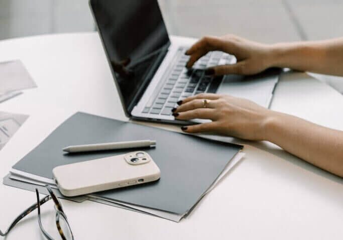 business owner typing on laptop