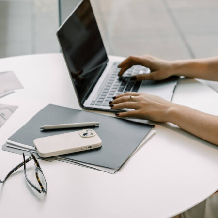 business owner typing on laptop