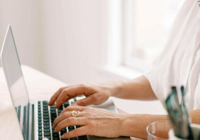 business owner working on seo website site speed at home desk