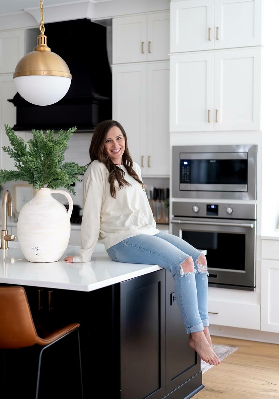 Stephanie-Okeefe-Owner-Of-Southern-Creative-Company Stephanie Okeefe, Owner Of Southern Creative Sitting On Kitchen Counter.