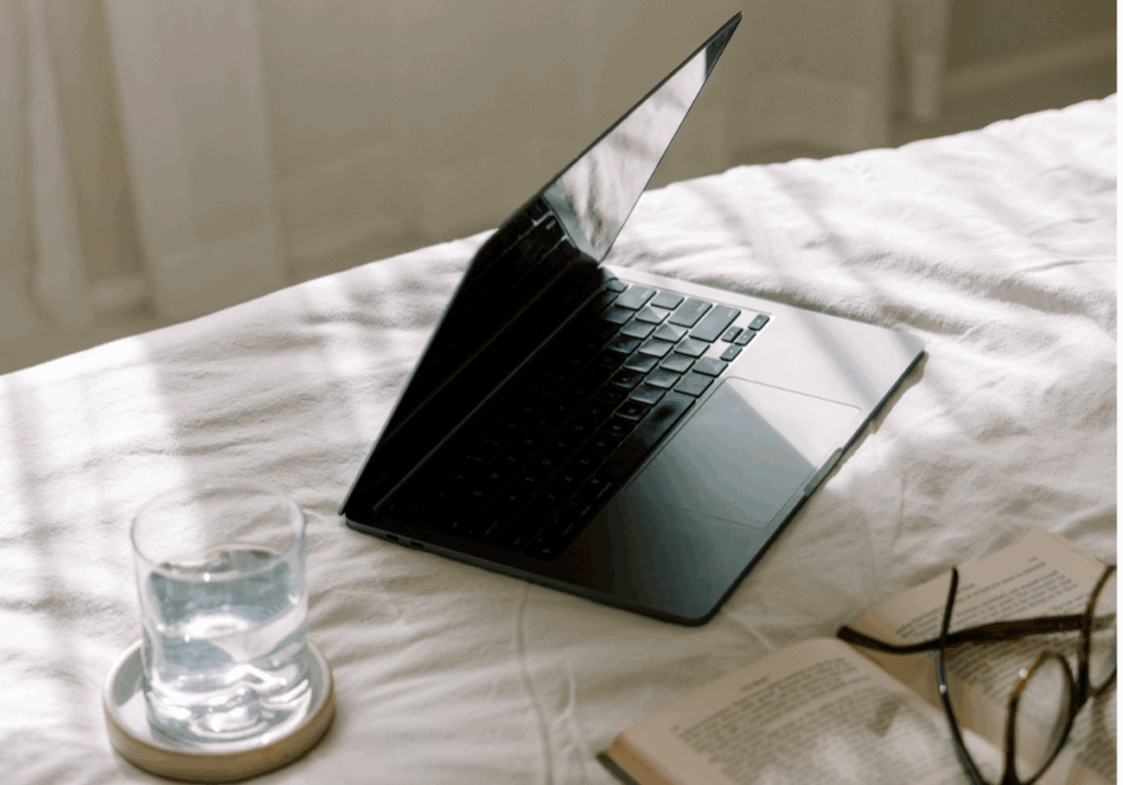 laptop at home on bed while working on website crawling and indexing