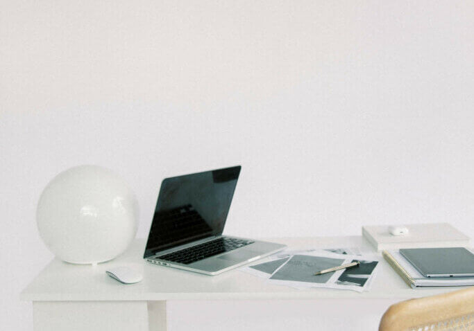 photo of work at home desk researching wordpress website theme vs template